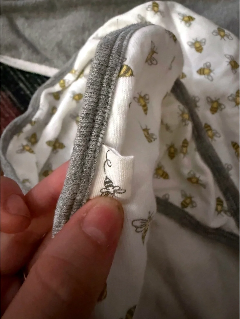 2 towels one gray one with bees ;brand is Burt’s beee